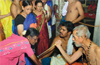 Devotees take part in Tapta Mudra Dharana